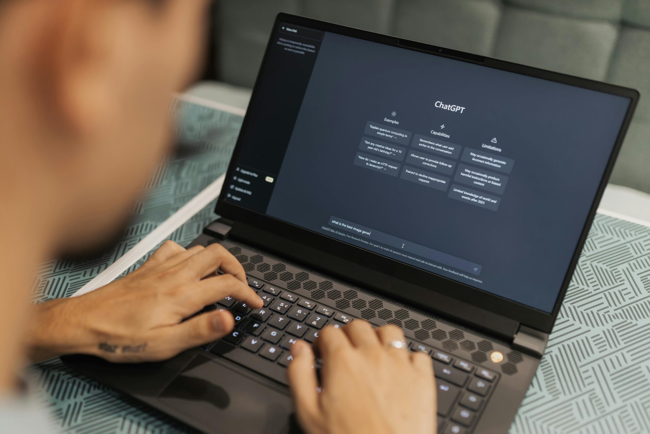 Digital AI workspace with ChatGPT on a laptop representing the best AI productivity tools for solopreneurs